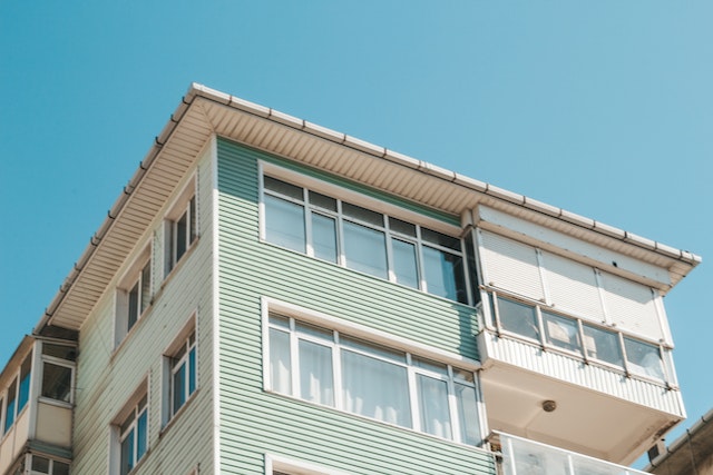 a beige home against a blue sky